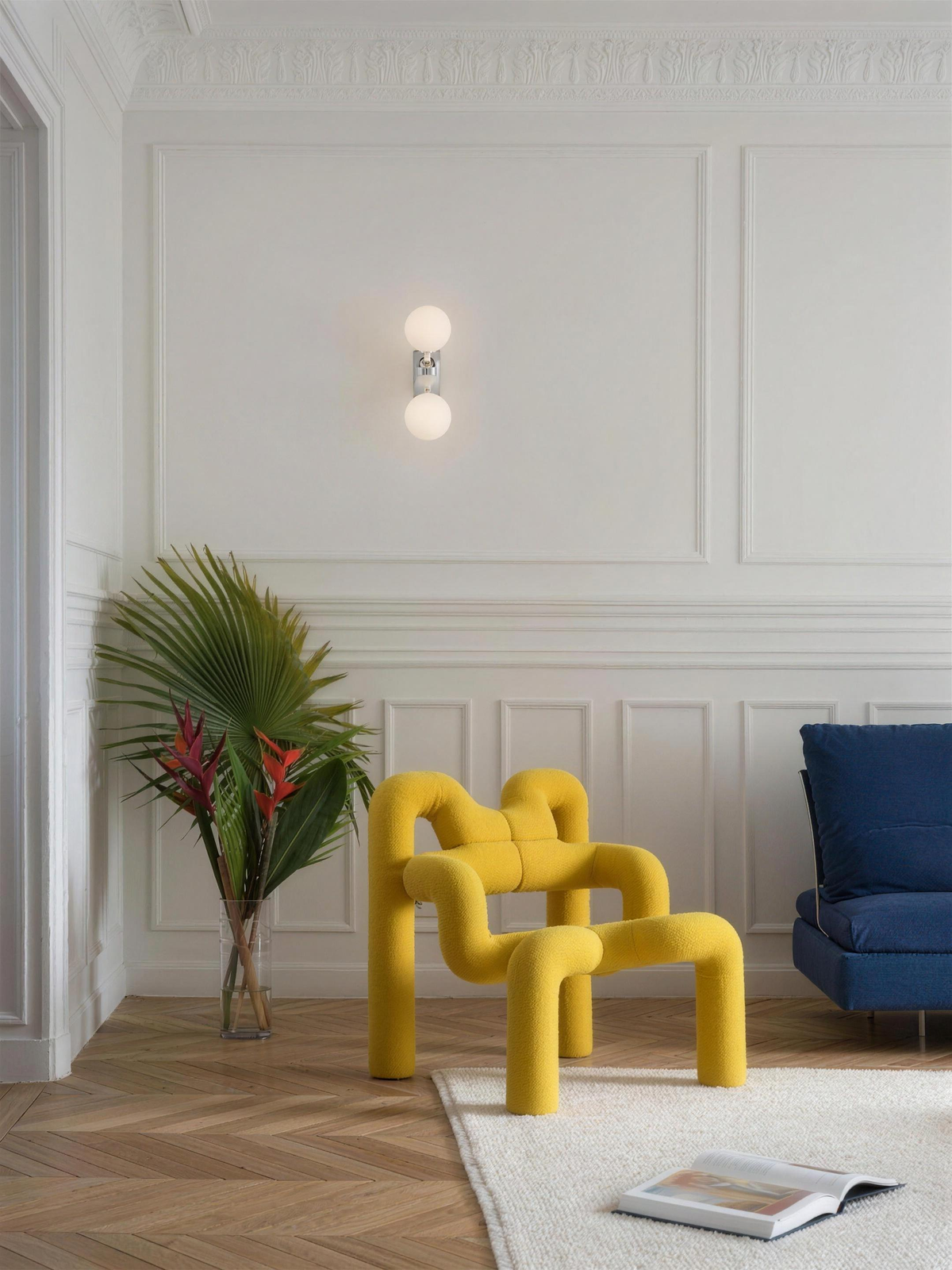Como wall light on a white panelled wall in a living room - Hestia + Co.