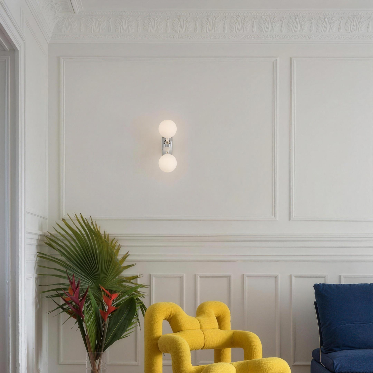 Como wall light on a white panelled wall in a living room - Hestia + Co.