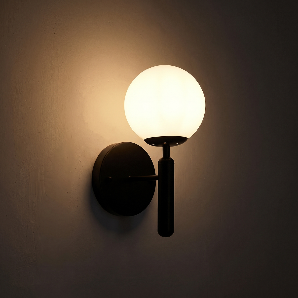 Bauer Black Wall Light - Hestia + Co. (night-time)