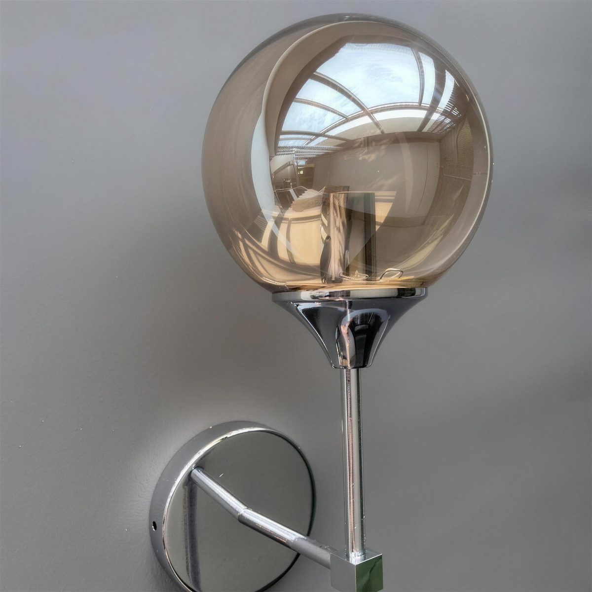 Marlow chrome wall light, close-up of the smoky grey globe - Hestia + Co.