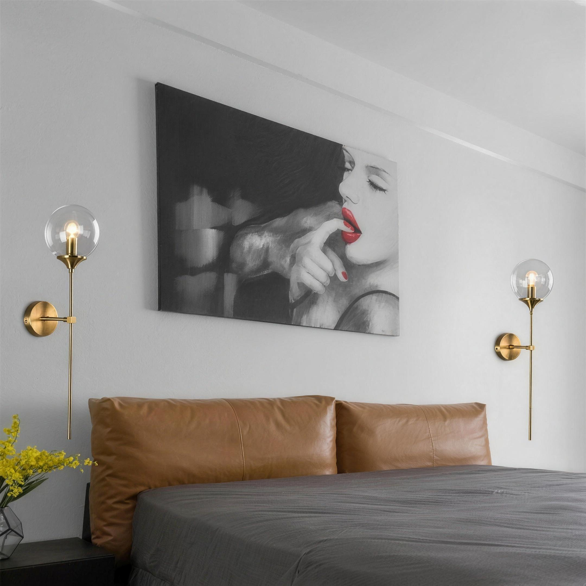 Marlow glass globe wall lights in gold either side of a bed - Hestia + Co.